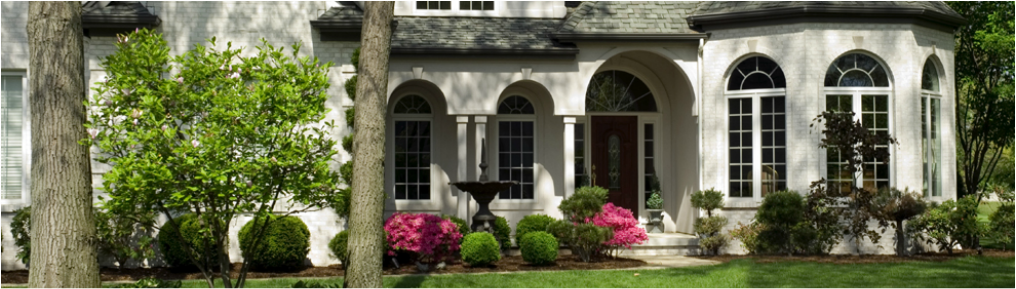 Picture depicting a beautiful home, lawn, trees, shrubs and landscaping
